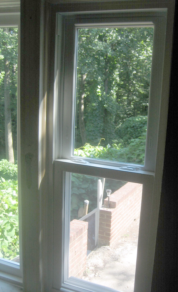 Satisfied homeowner with quality roof replacement